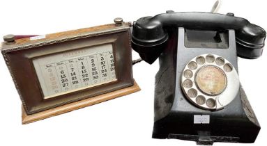 A Vintage Black Bakelite telephone & an antique desk calendar