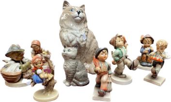 A Collection of Eight West German Hummel figures along with a Beswick fire side cat figure and