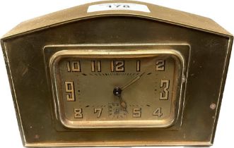 An antique french brass travel clock [in a working order] [9.5cmx14cm]