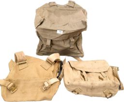 A collection of three world war military rucksacks to include radio transceiver bag (empty) along