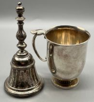 Georg Jensen Denmark Sterling silver christening mug, together with a silver service bell. [