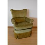 Fauteuil crapaud vert sur roulettes avec cousin en duvet