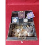 Safe tin with mixed coins. Tin has key