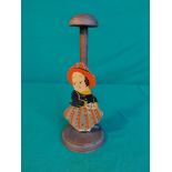 Vintage wooden hat stand with a lady to the front