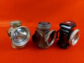 3 Antique bicycle lamps.