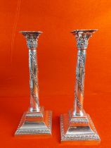Pair of hallmarked silver candle sticks dated 1884. 13.5" height.