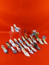 Collection of 27 miniature shoes in different styles.