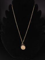 Half Sovereign pendant on 9ct gold necklace. Weight 10 grams