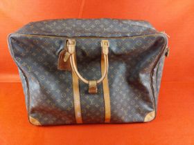 Authentic Louis Vuitton Sirius 65 Monogram soft sided suitcase/travel bag. Serial number SP0932.
