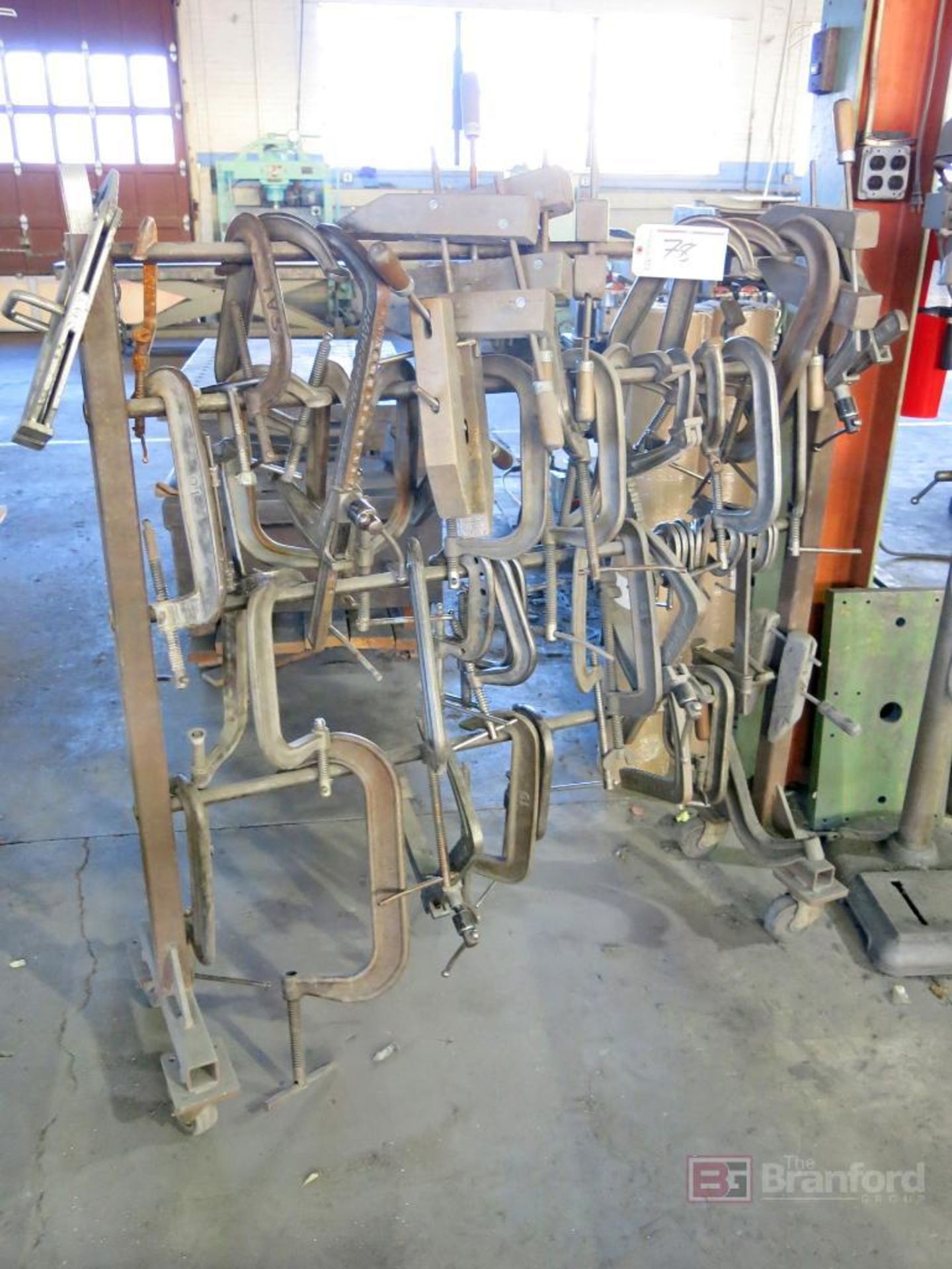 Large lot of C-clamps, wood clamps on custom rack