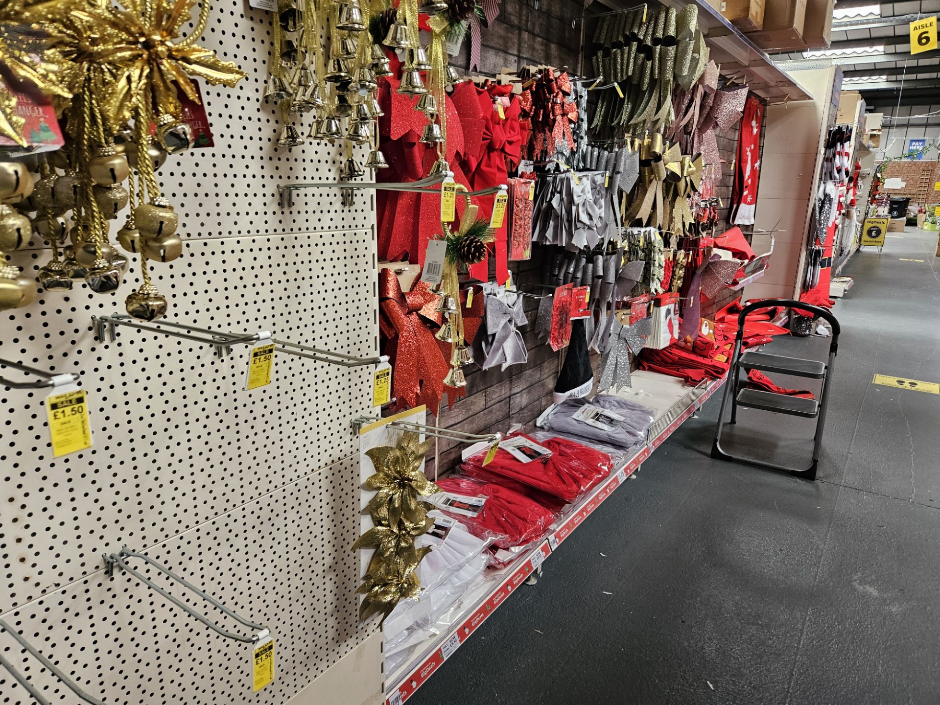 Aisle of Christmas bows & stockings. Shelving not included.