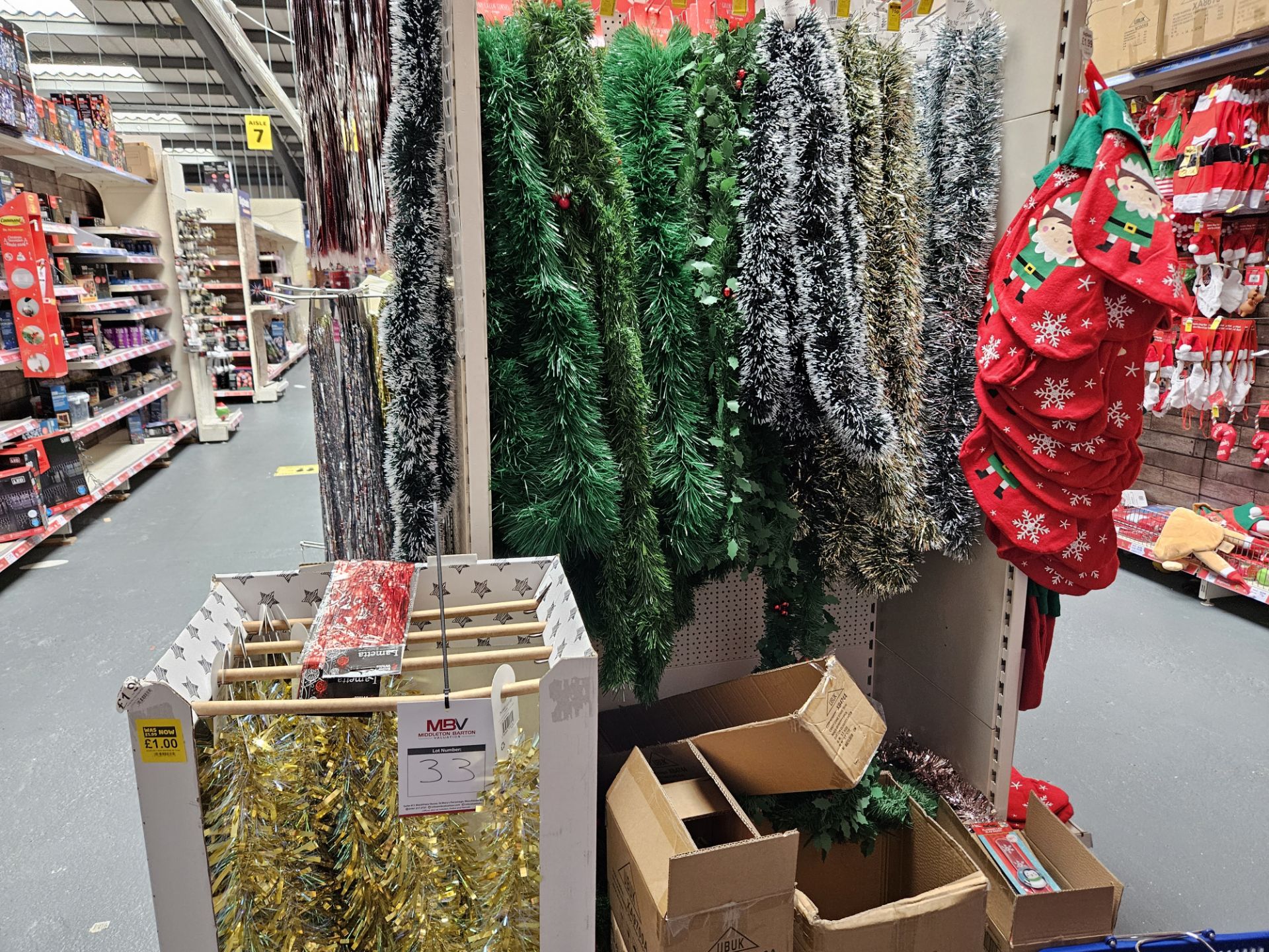 Assorted tinsel and Christmas stockings. Shelving not included.