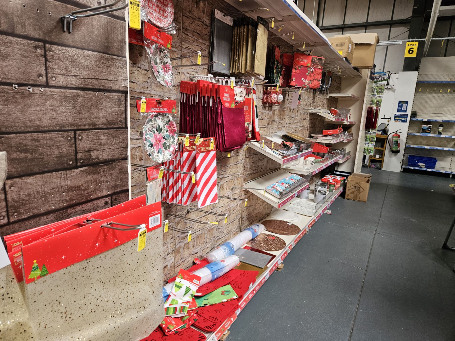 Twin aisle of Christmas lighting and candy cane decorations. Shelving not included.