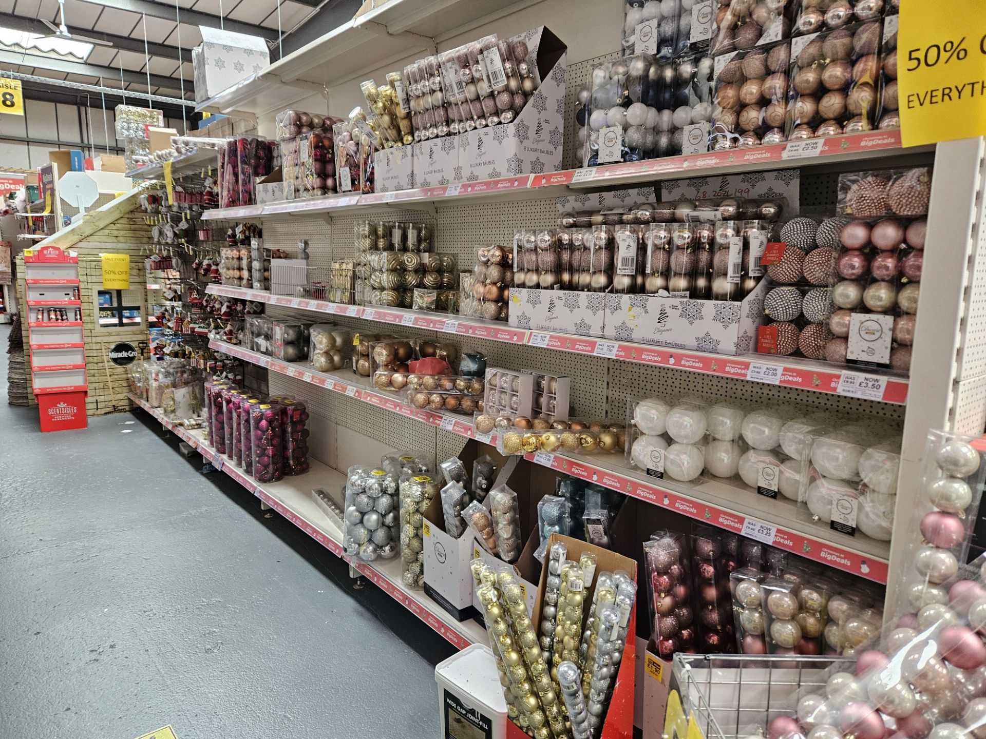 2 Aisles of assorted Christmas tree decorations and baubles. Shelving not included.