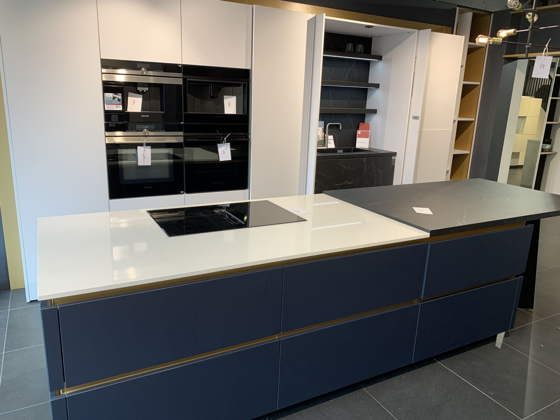 Complete Fitted Kitchen in white & blue with immitation marble finish counter tops