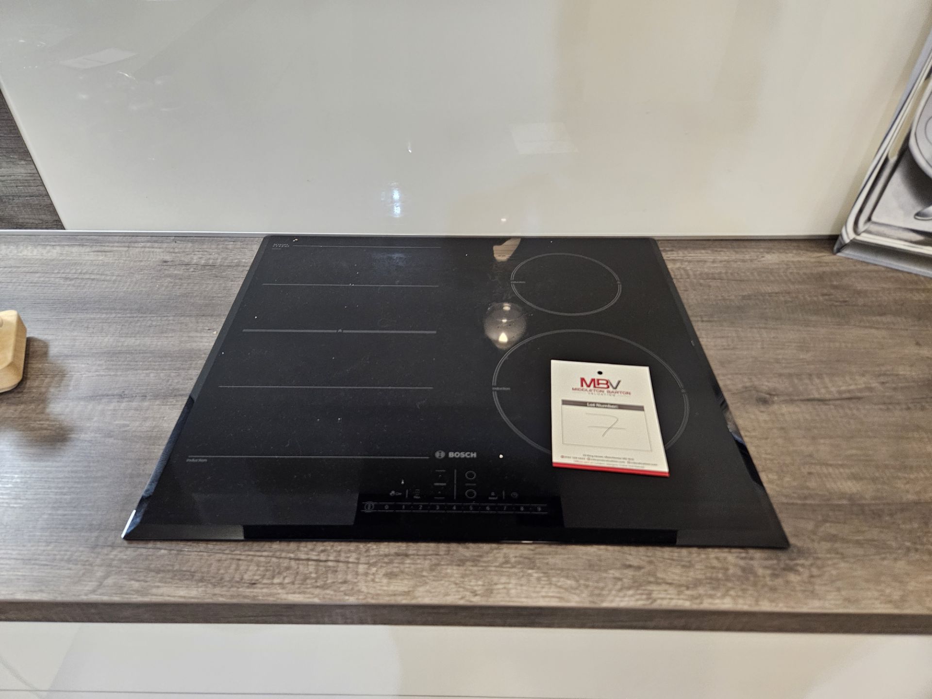 Bosch induction hob in black and Bosch wall mounted cooker hood in gloss black - Image 4 of 6