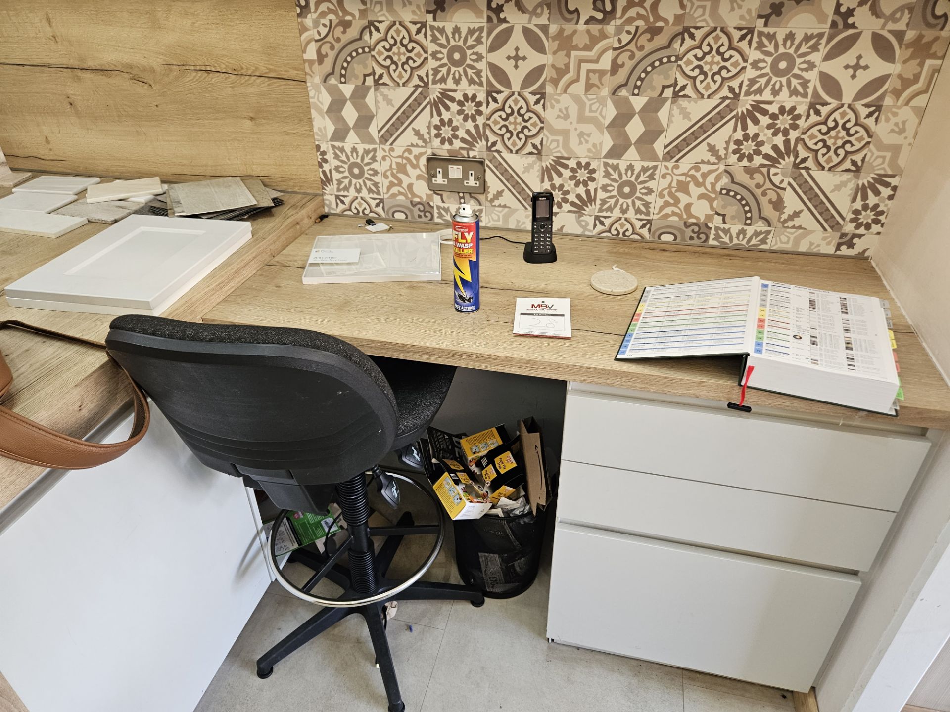 Fitted office desk with drawer unit in white, overhead cupboard / shelving unit and swivel chair