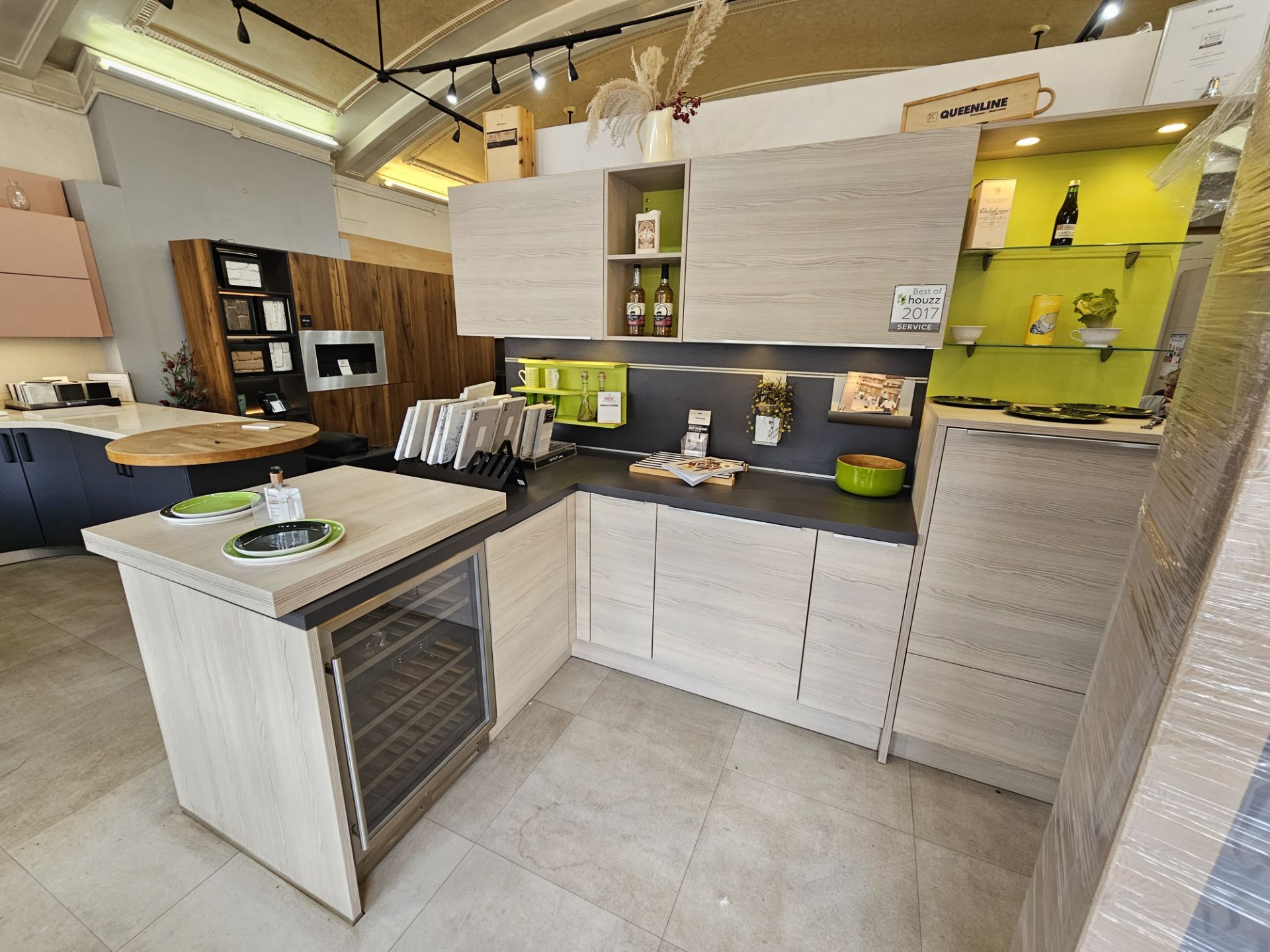 Display Kitchen with laminate woodgrain doors, laminate surface, splash back and sliding bar feature