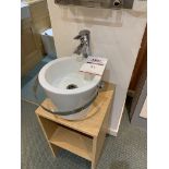 Display cloakroom sink on floating pedestal