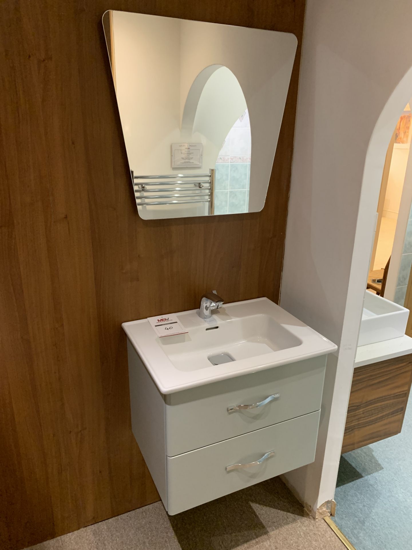 Dsiplay bathroom sink on floating pedestal and mirror
