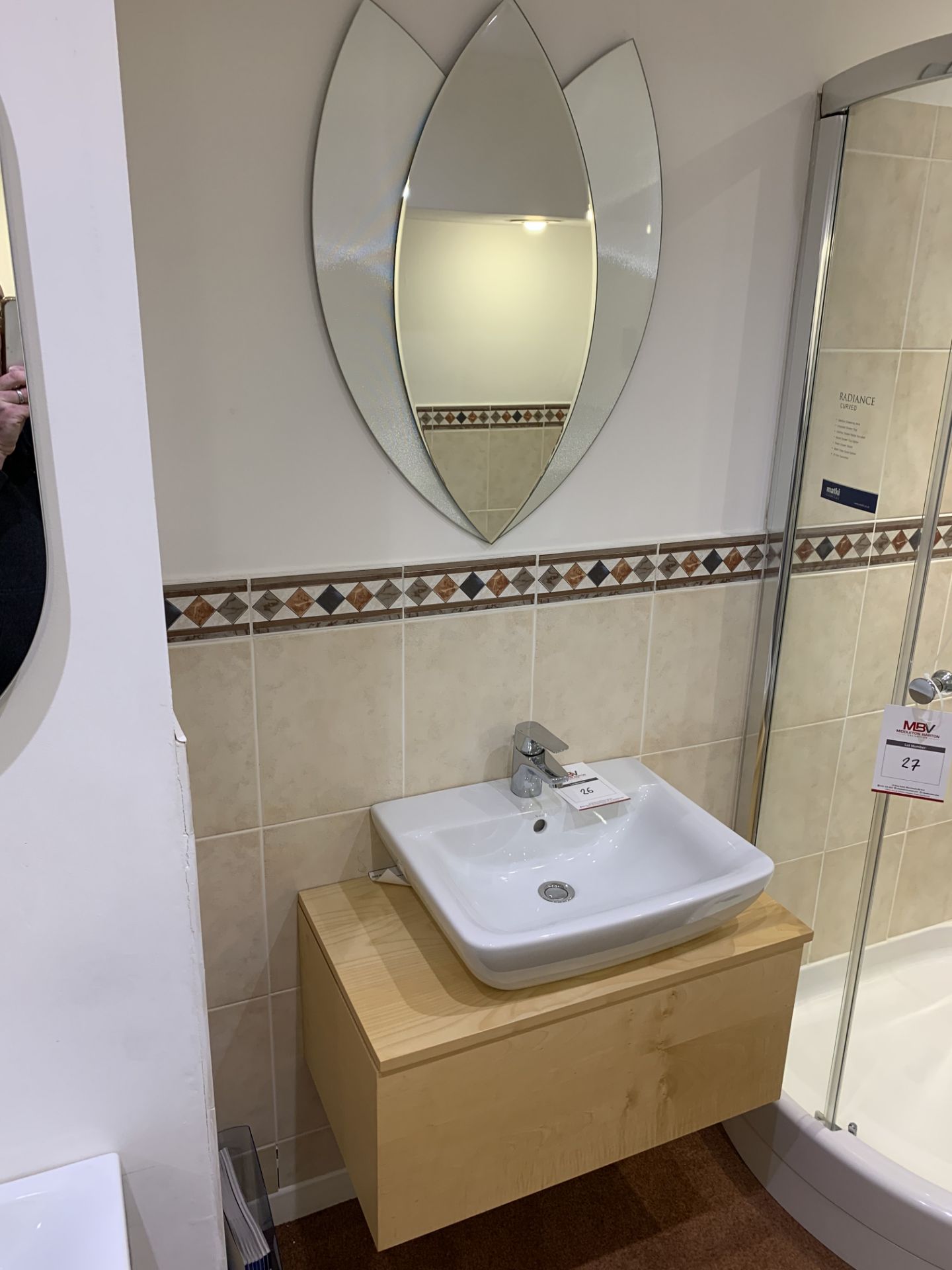 Display bathroom sink on floating pedestal with mirror