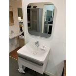 Display bathroom sink on floating pedestal with mirror