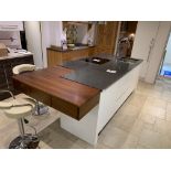 Display kitchen island in white & mahogonay with flecked black Silestone work surface