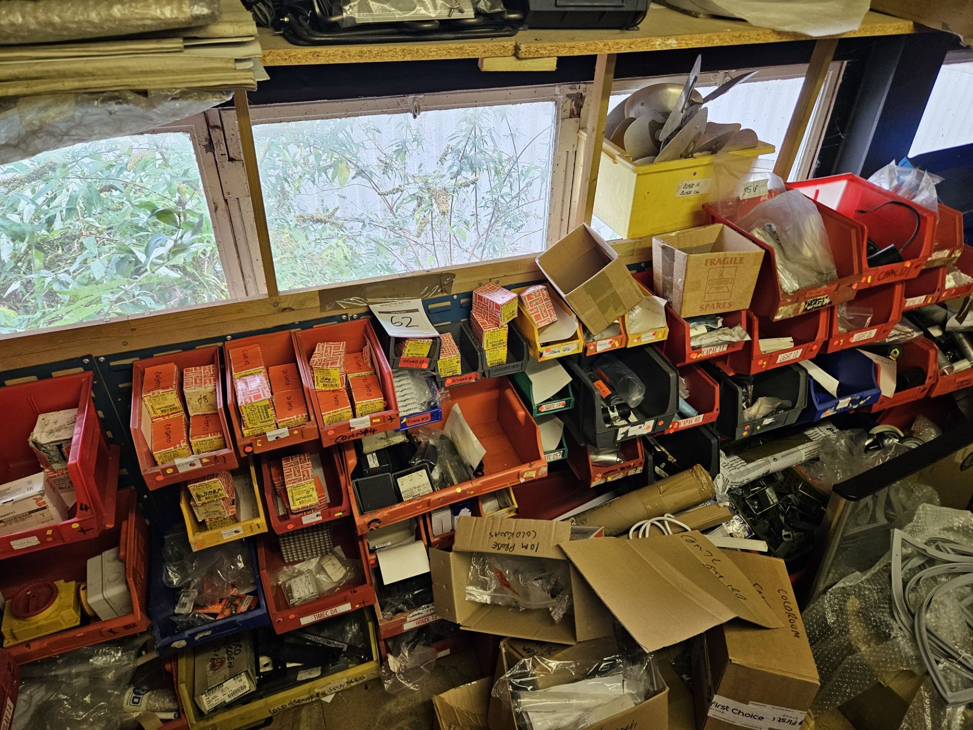 back wall of stock Boxes to include contents of lights bulbs cappers bolts and control fridge freeze