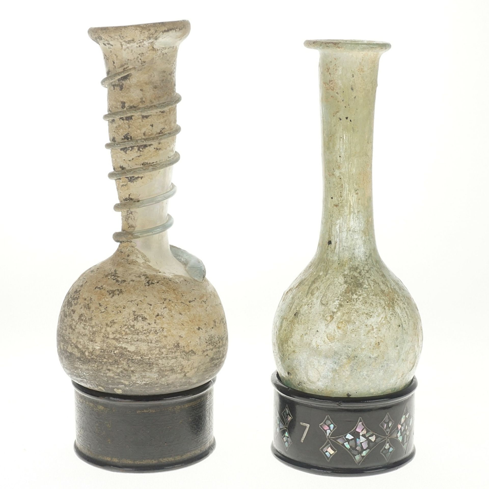 Two small glass bottles based on models from Roman antiquity