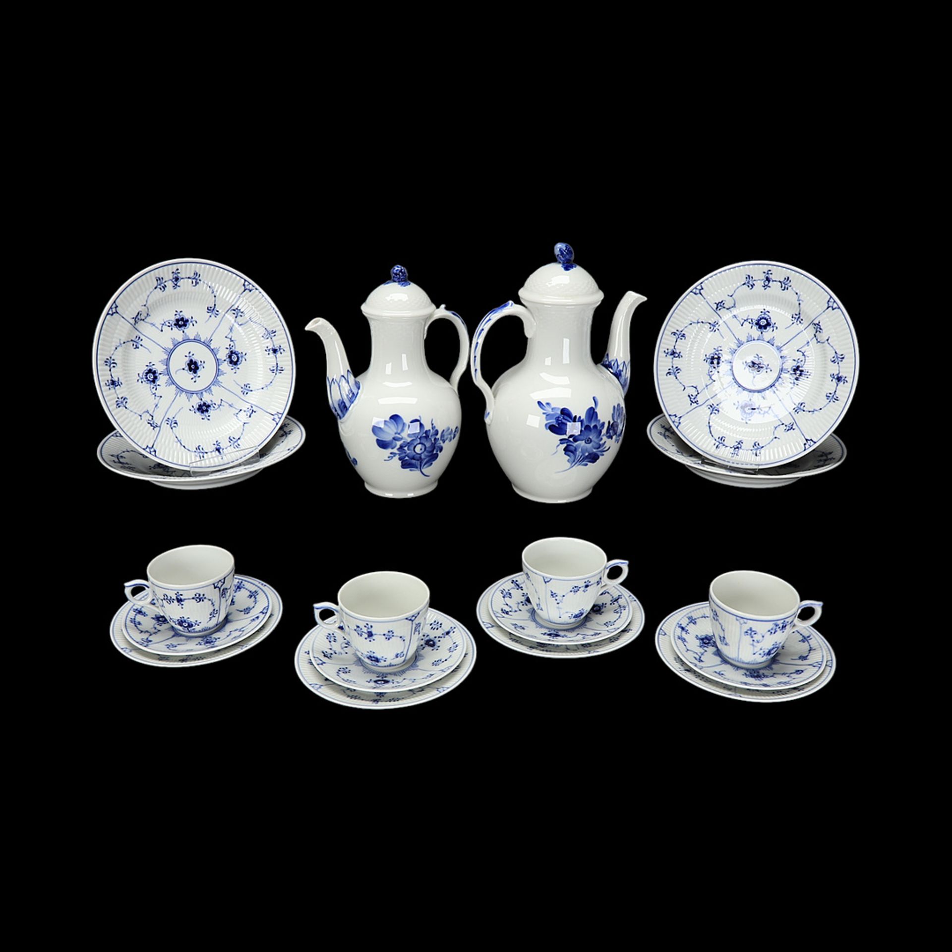 Four Royal Copenhagen place settings and two jugs