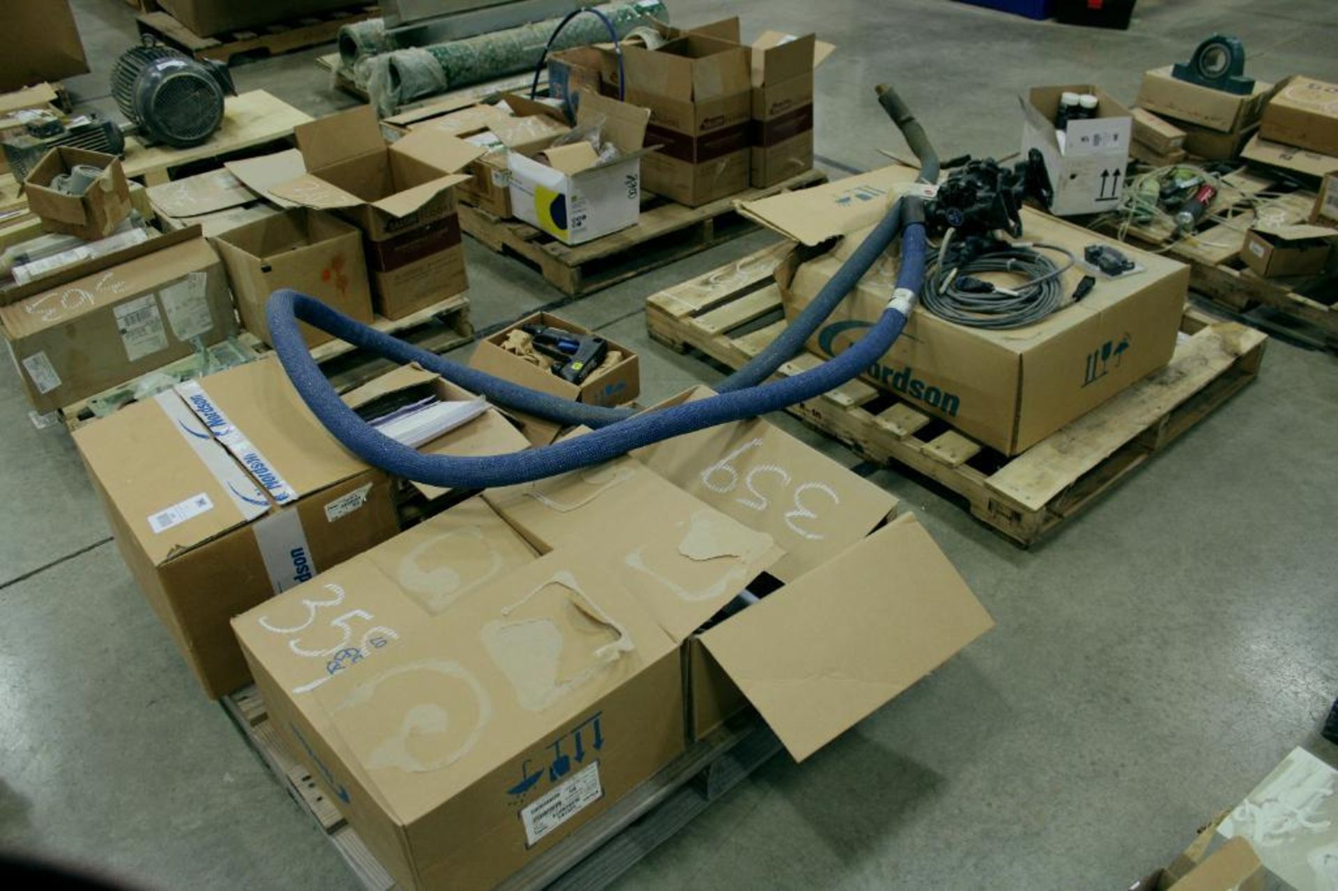 (2) pallet of Nordson Glue Parts