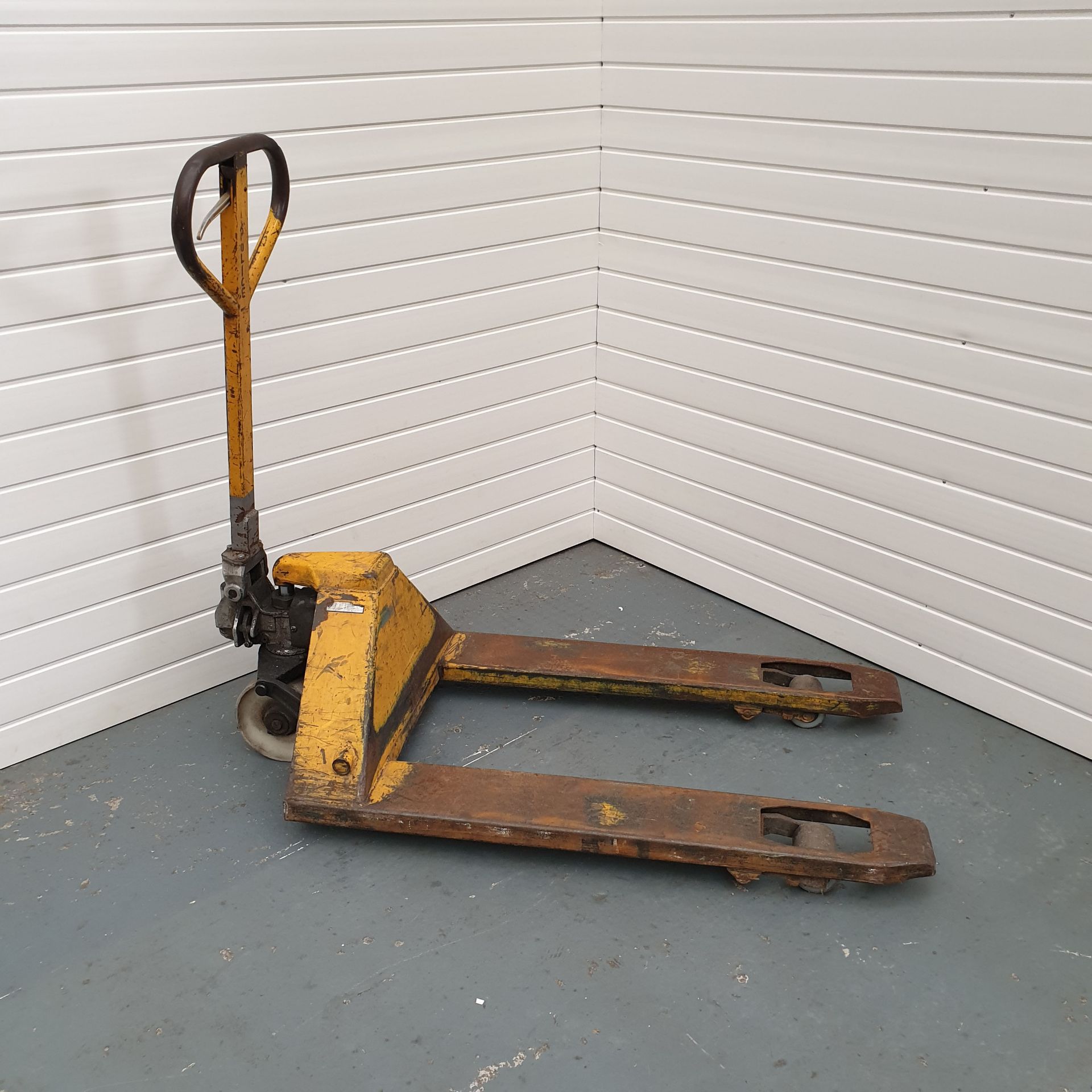 Wide Pallet Truck Between Forks 14". Total Width 27". Total Length of Forks 39 1/2".