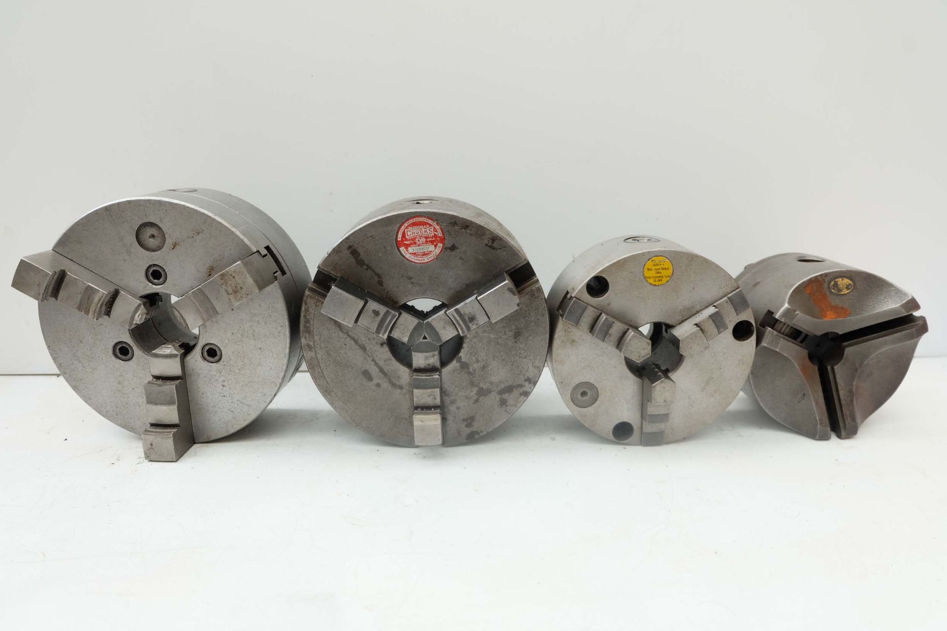 3 x Three Jaw Chucks plus another Without Jaws. 200mm, 160mm, 7 1/2" & 5 1/2" Diameters.