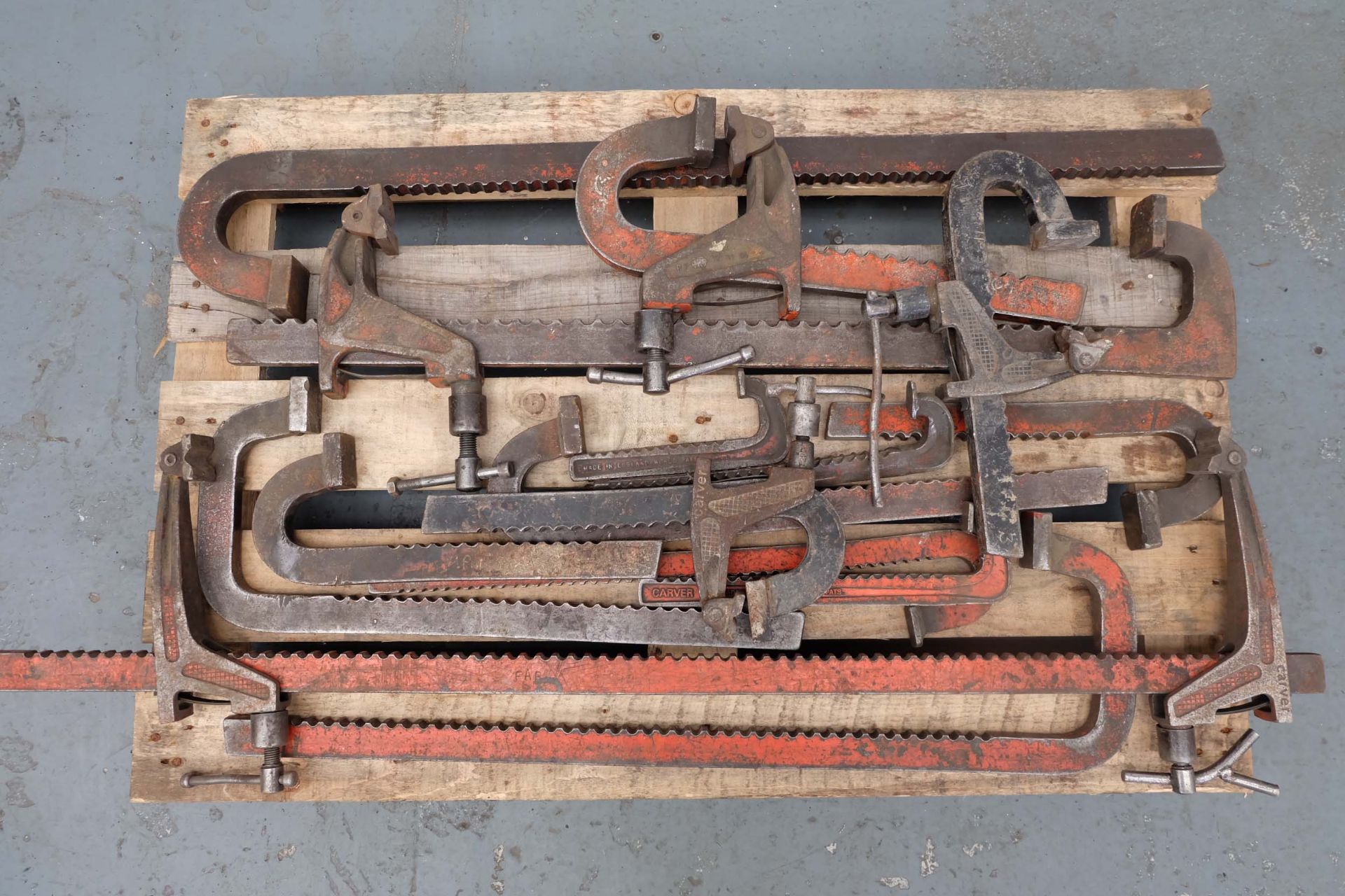 Quantity of Carver Clamps and parts of Carver Clamps.