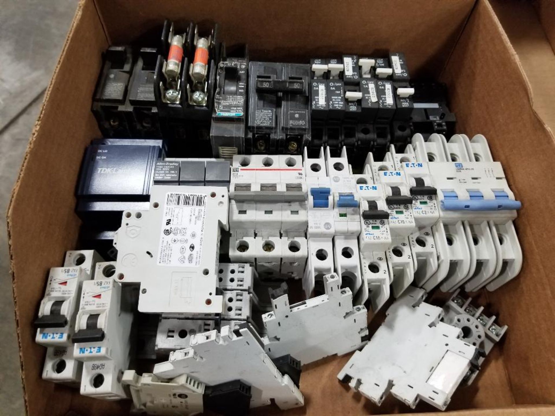 Assorted electrical breakers, relay holder. Eaton, TDK-Lambda, Siemens.