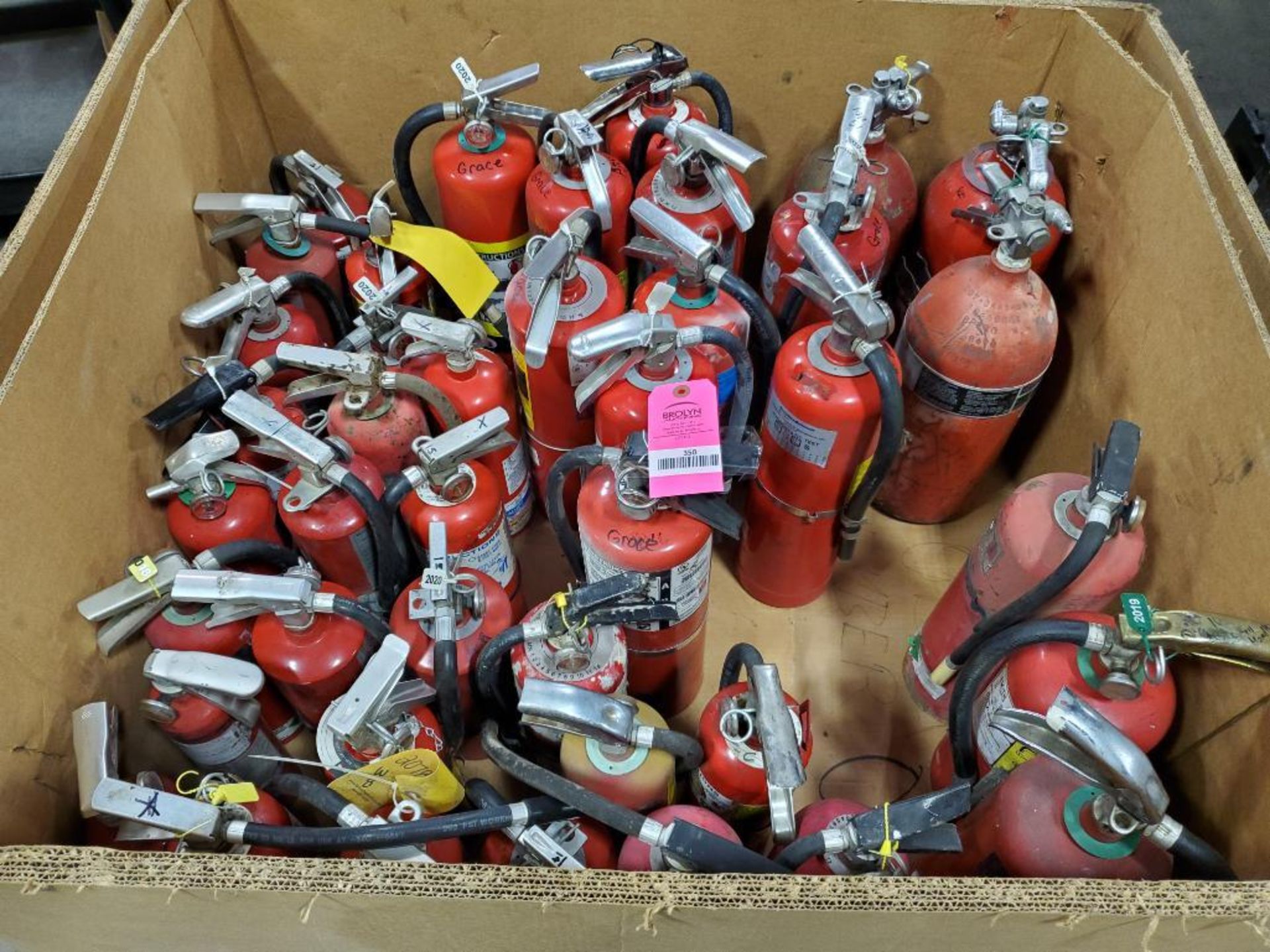 Gaylord of assorted fire extinguisher canister.