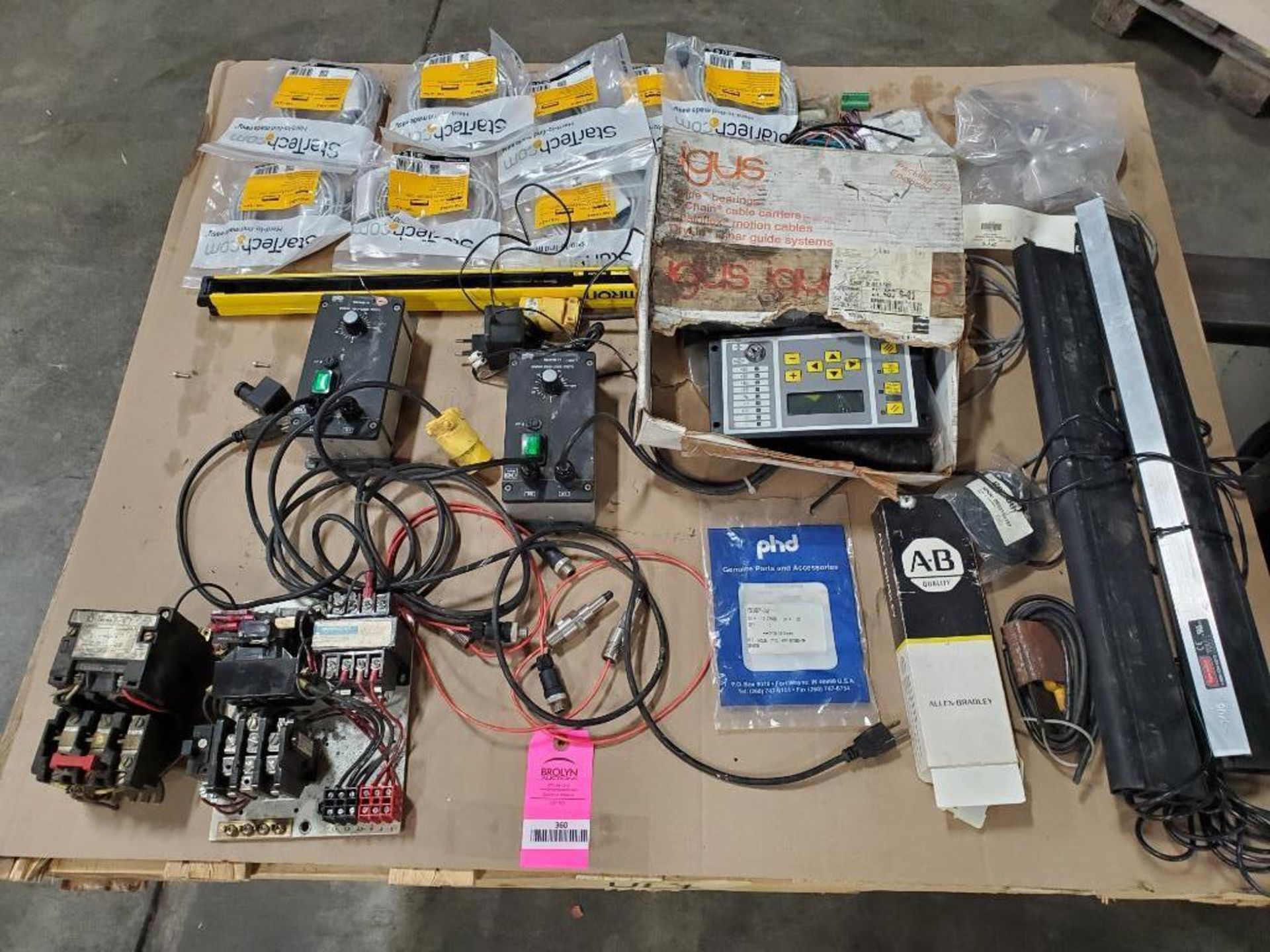 Pallet of assorted electrical. Controllers, connection cords, starters, replacement parts.