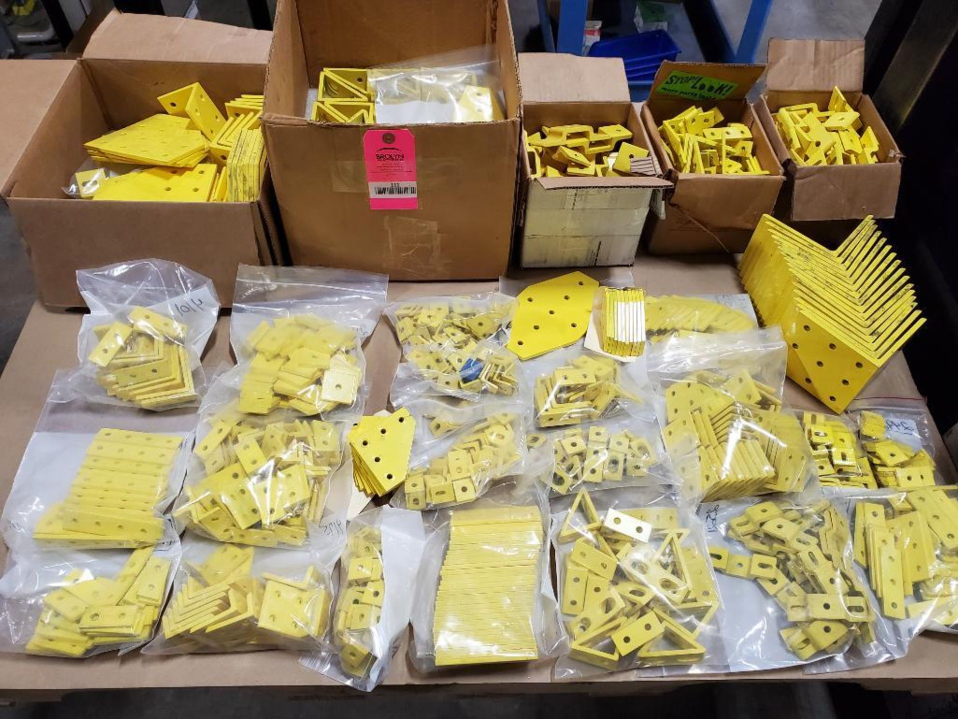 Pallet of assorted gold / yellow bracket hardware plates. Rexroth. New no boxes.