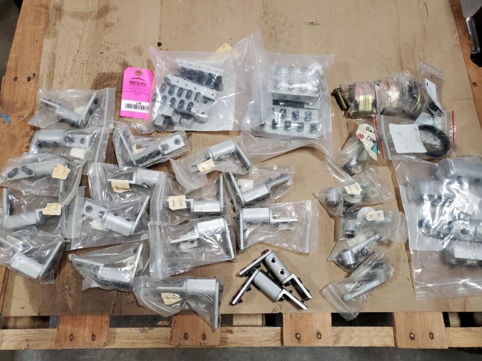 Assorted hardware fittings, brackets, clamps.