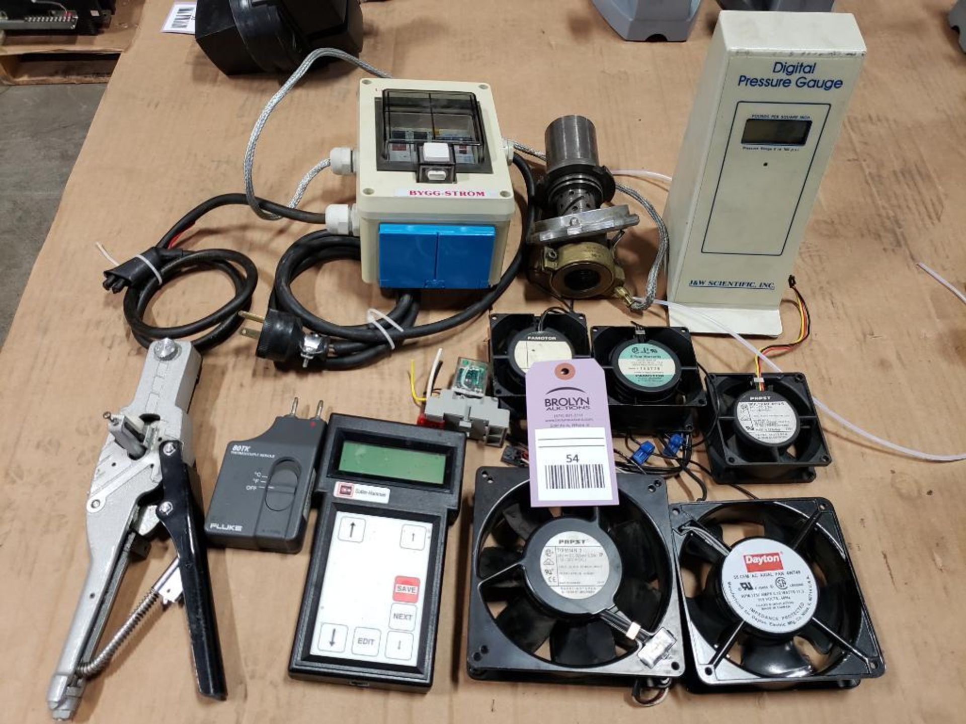 Assorted electrical fans, digital pressure gauge, breaker box. Luca, Cutler Hammer, Fluke.