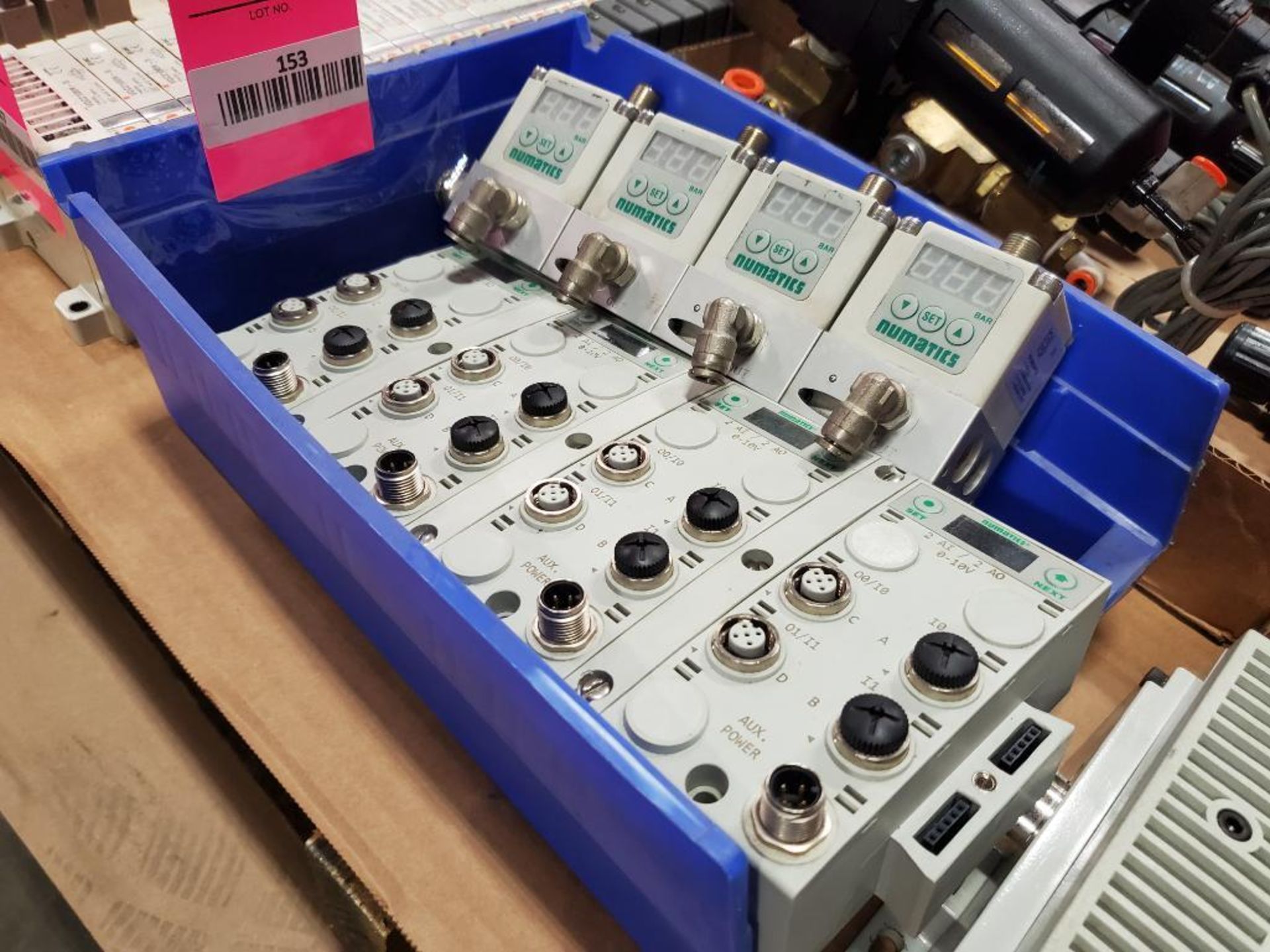 Assorted Numatic brand pneumatic valves and components.