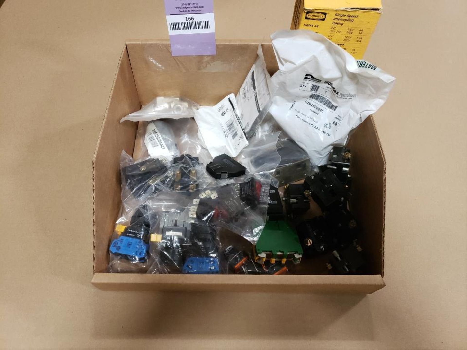 Assorted electrical button parts.
