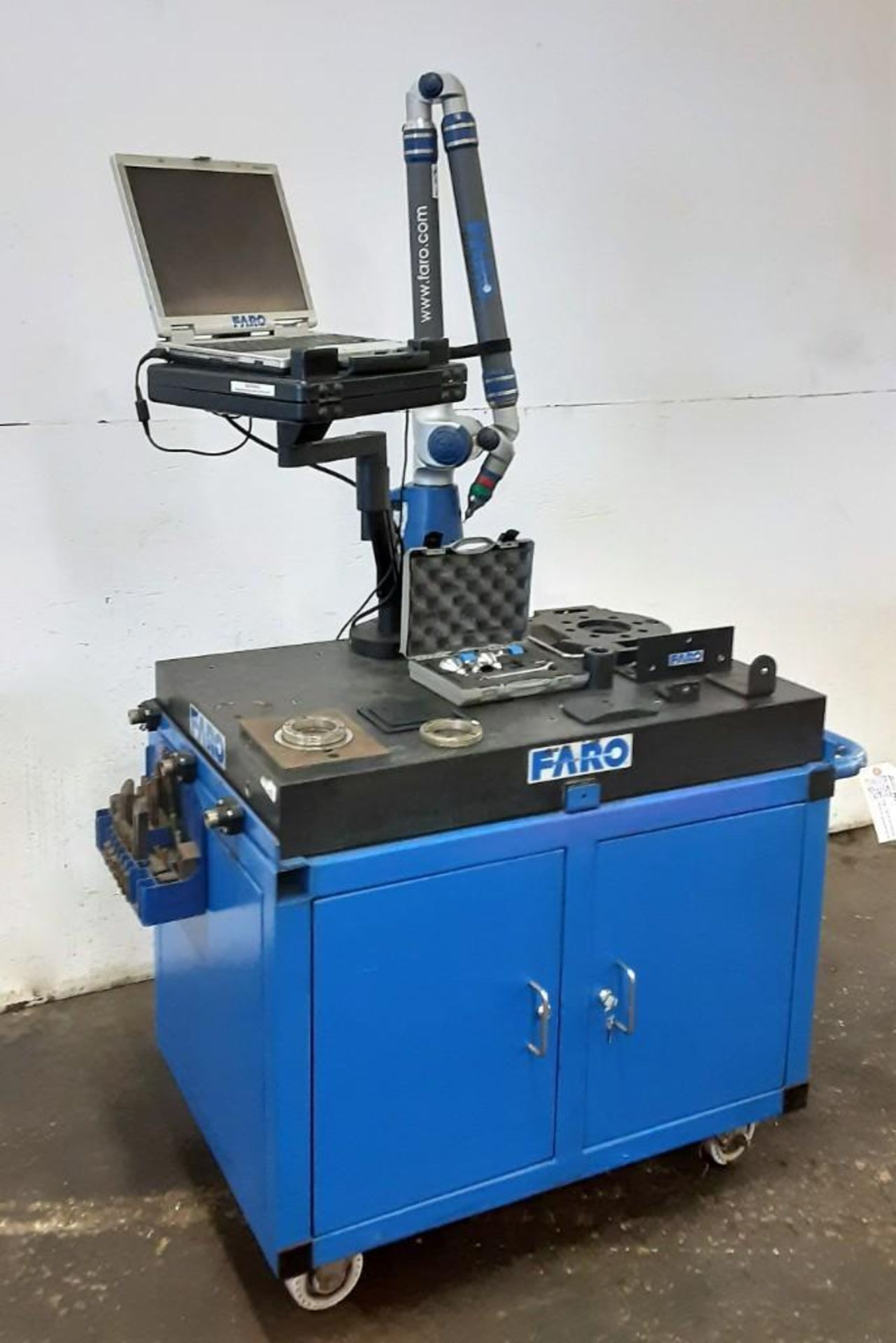 FARO portable CMM titanium arm with granite surface plate, computer and cart.