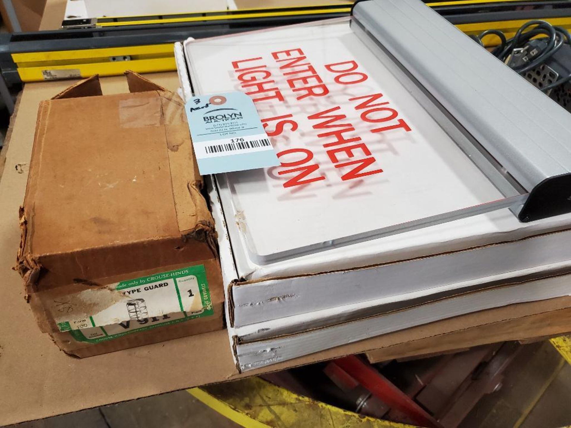 Assorted electrical lighting signs and explosion proof cover. New in box. Crouse-Hinds, Acuity Brand