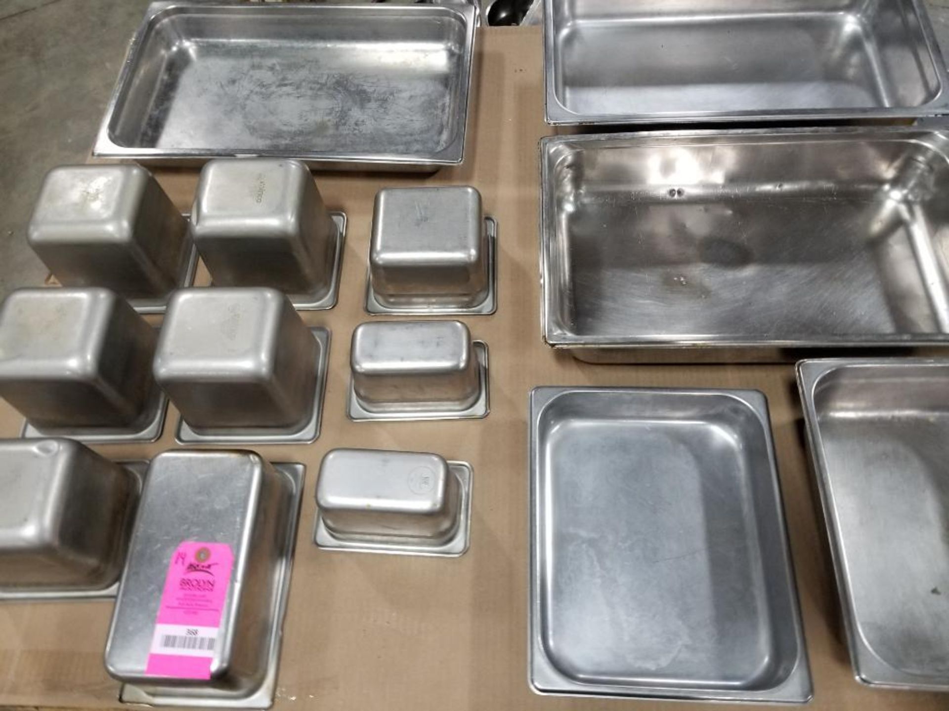 Stainless steel steam table pans.