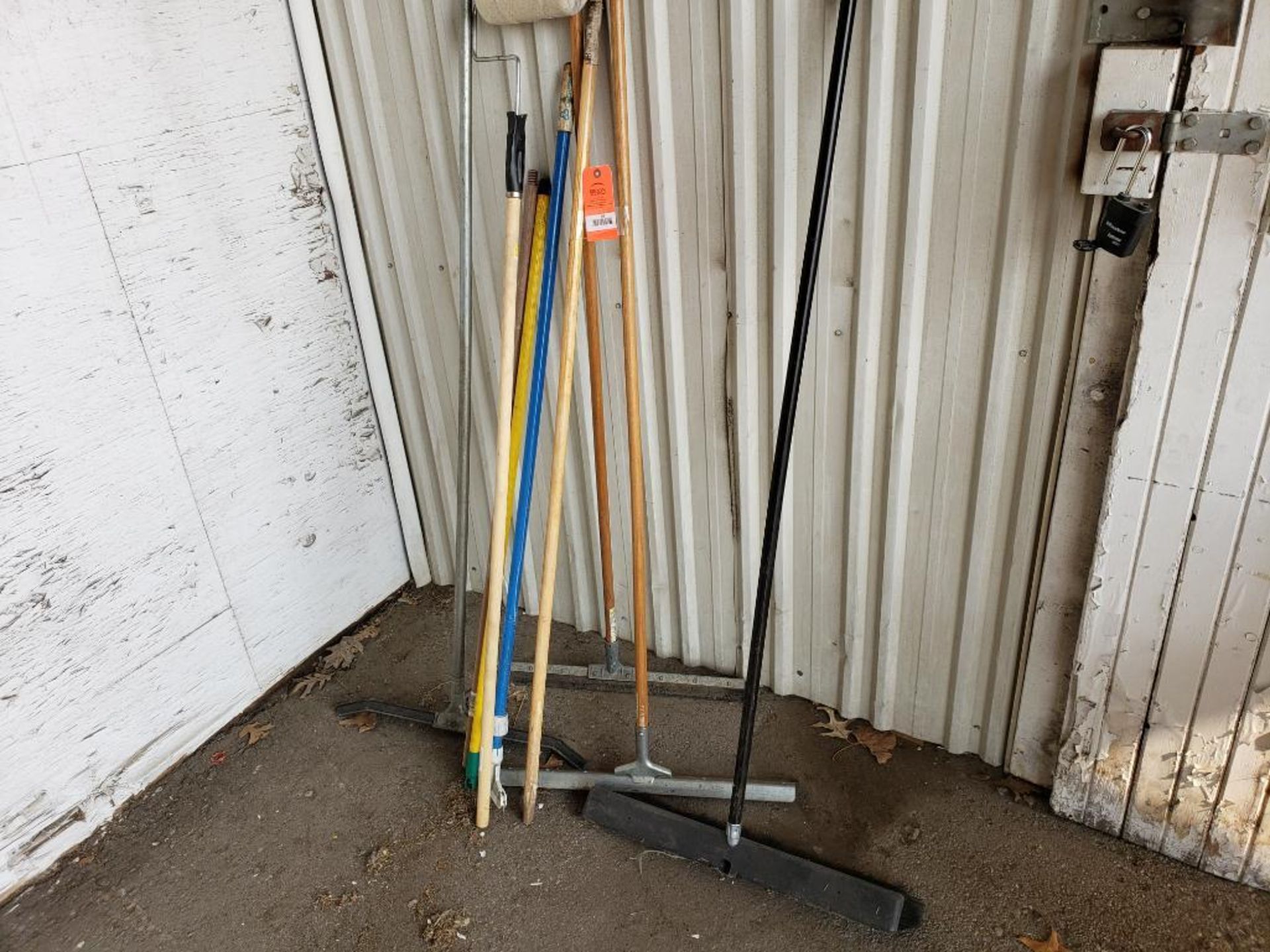 Assorted shop cleaning tools.