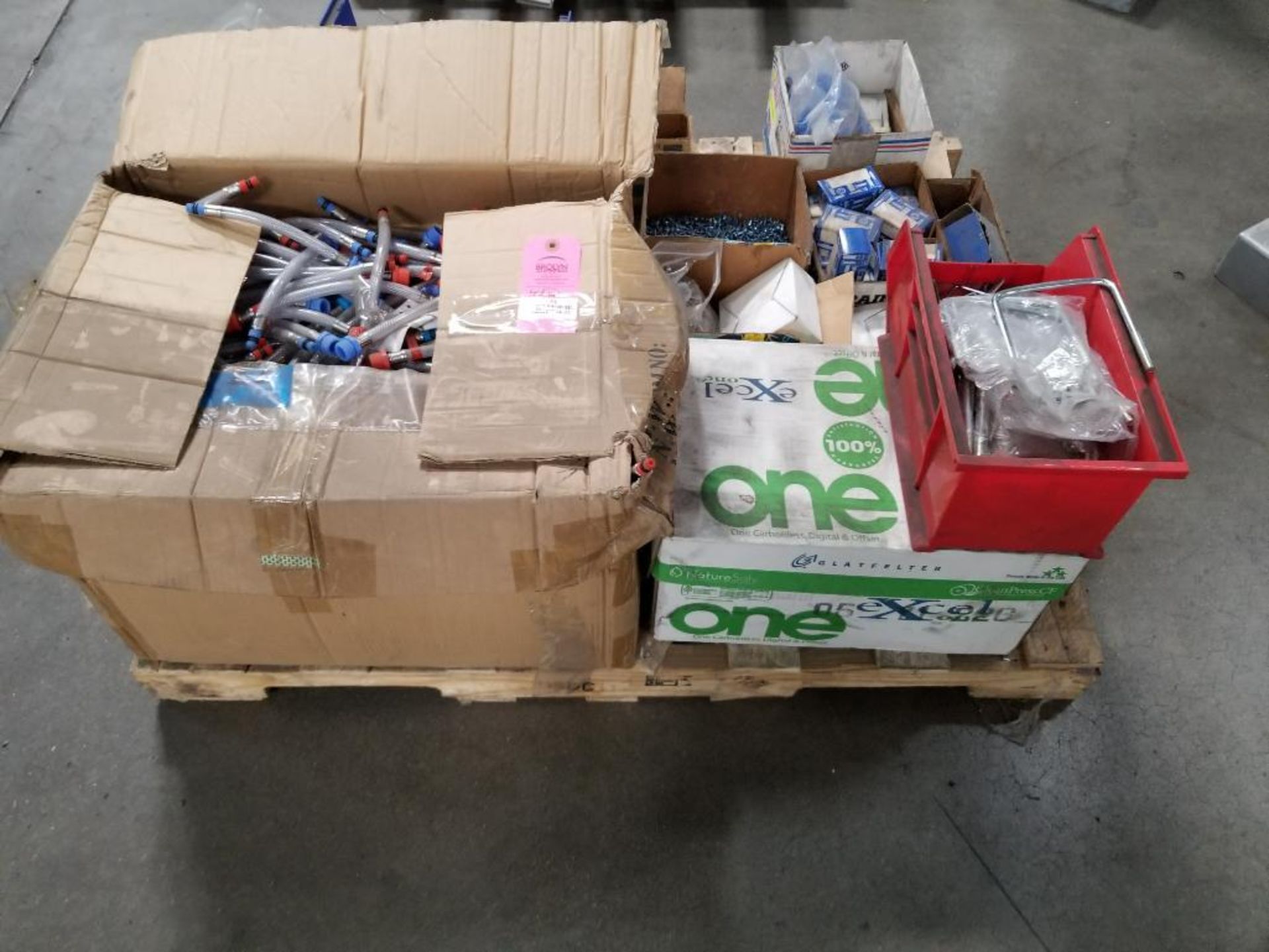 Pallet of assorted replacement parts, hardware.