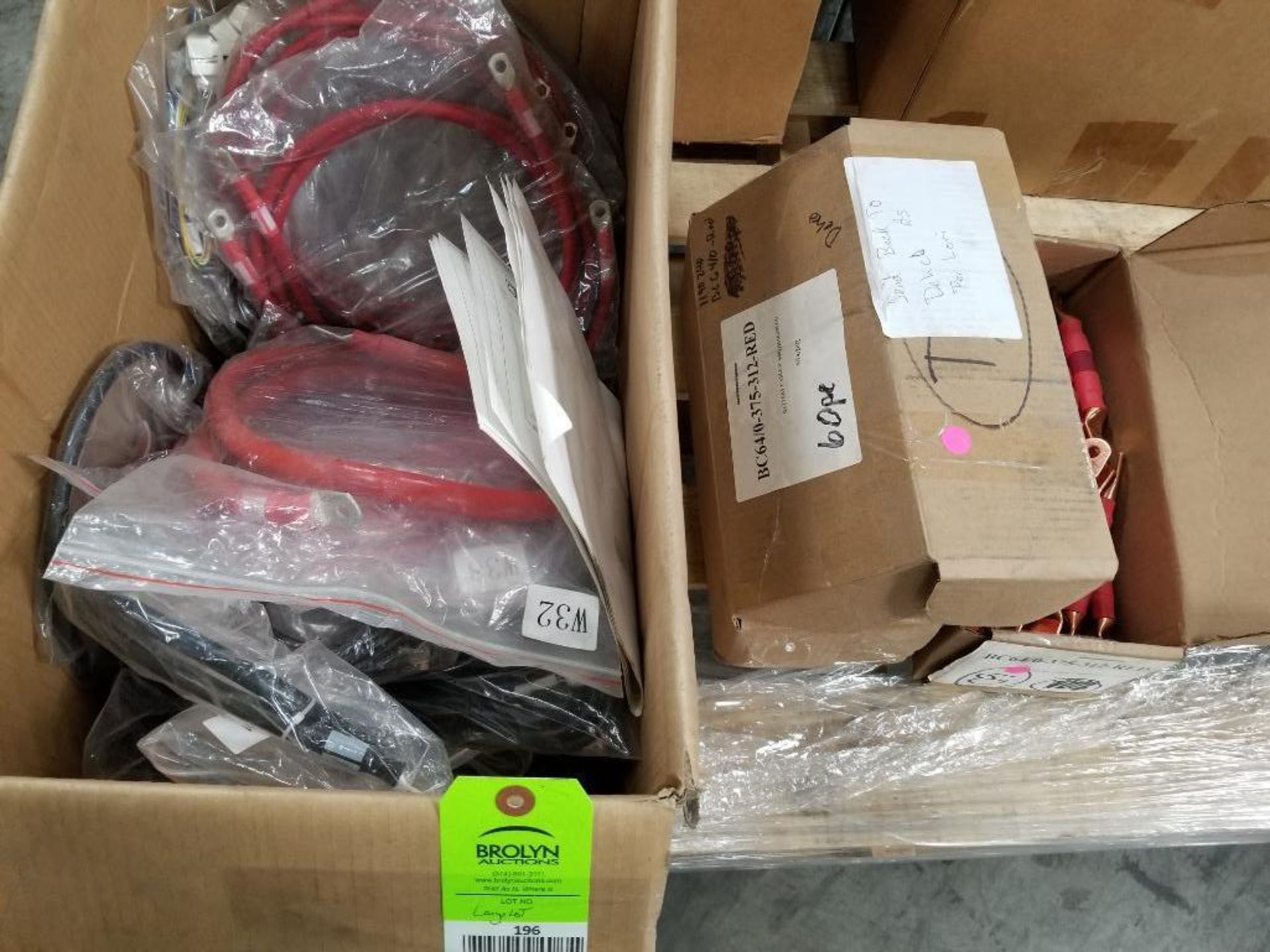 Large lot of assorted battery cables.