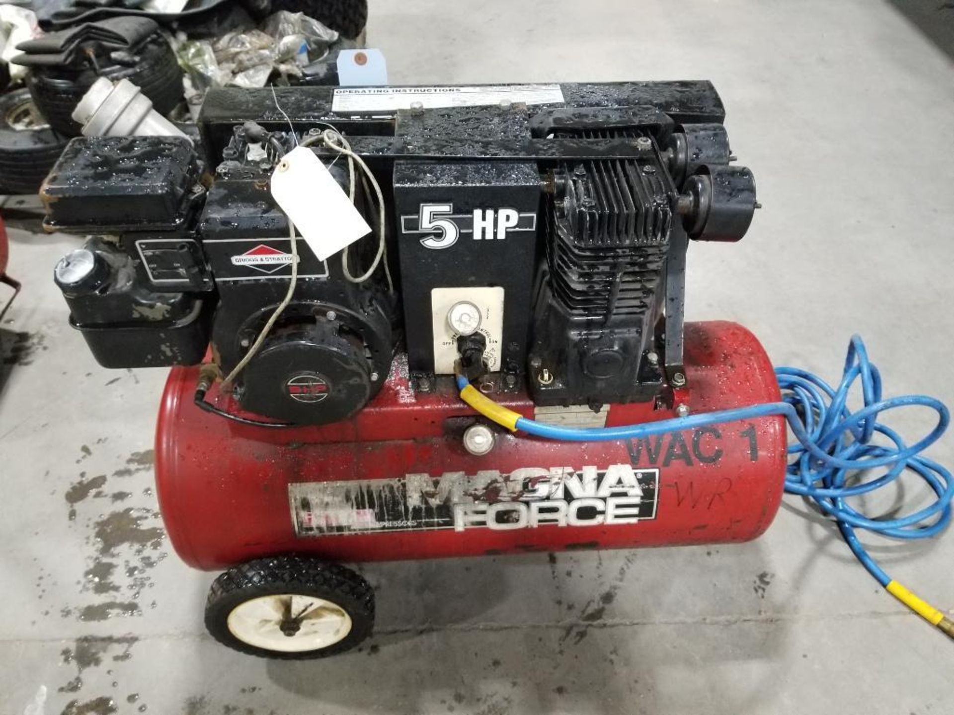 Repairable Briggs and Stratton 5hp air compressor. Needs carb and pull start.