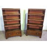 A pair of Regency style waterfall open front bookcases, early 20th century, each with a single